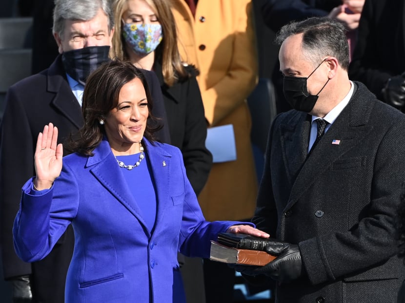 Mdm Kamala Harris, flanked by her husband Mr Doug Emhoff, is sworn in as the 49th US Vice President by Supreme Court Justice Sonia Sotomayor on January 20, 2021, at the US Capitol in Washington, DC.