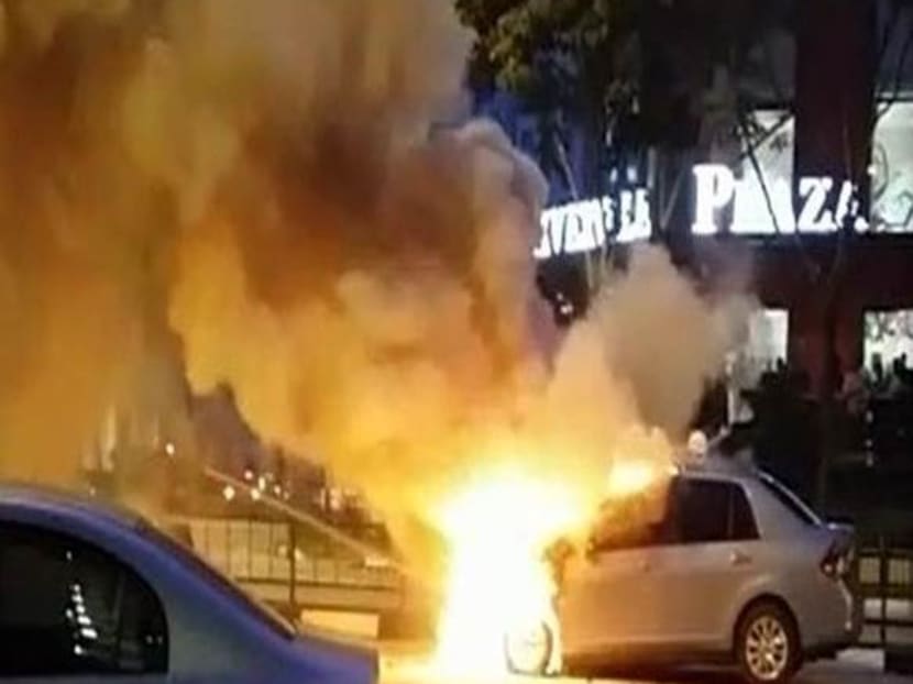 The car that was on fire at junction of Rivervale Lane and Punggol Road. Photo: Andy