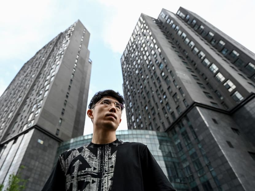 This photo taken on June 29, 2022 shows Mr Sheldon Zhang, an employee for a technology company, posing for a portrait in Beijing's middle-class neighbourhood of Shangdi. This photo taken on June 29, 2022 shows Mr Sheldon Zhang, an employee for a technology company, posing for a portrait in Beijing's middle-class neighbourhood of Shangdi.