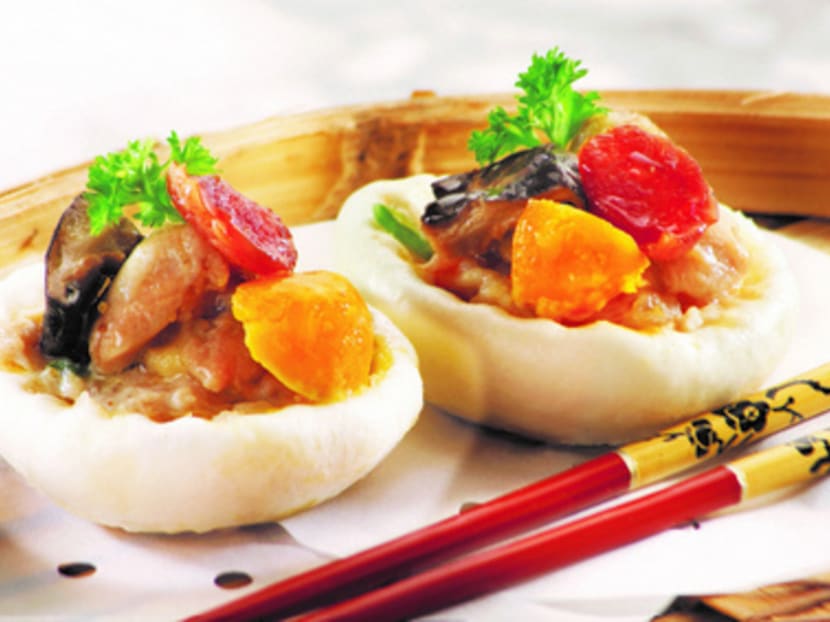Bao Today's Half Bao is literally one half of a whole bun, filled with a mix of mushrooms, Chinese sausage, shrimp, chicken meat, salted egg yolk and pork.