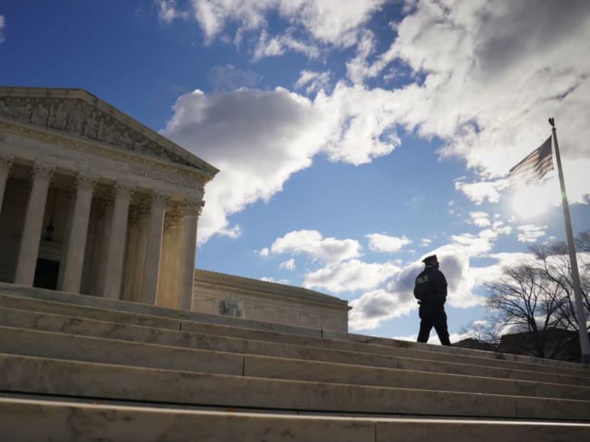 A police officer patrols the front of the United States Supreme Court in Washington, US, Dec 22, 2020.
A police officer patrols the front of the United States Supreme Court in Washington, US, Dec 22, 2020.