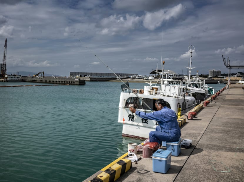 A man fishes from a pier on Ishigaki, a small Japanese island just 200 miles (322km) from Taiwan, on Nov 4, 2021. Japan has warned that growing tensions between Chinese and American forces could pose a serious risk to regional stability. A man fishes from a pier on Ishigaki, a small Japanese island just 200 miles (322km) from Taiwan, on Nov 4, 2021. Japan has warned that growing tensions between Chinese and American forces could pose a serious risk to regional stability.