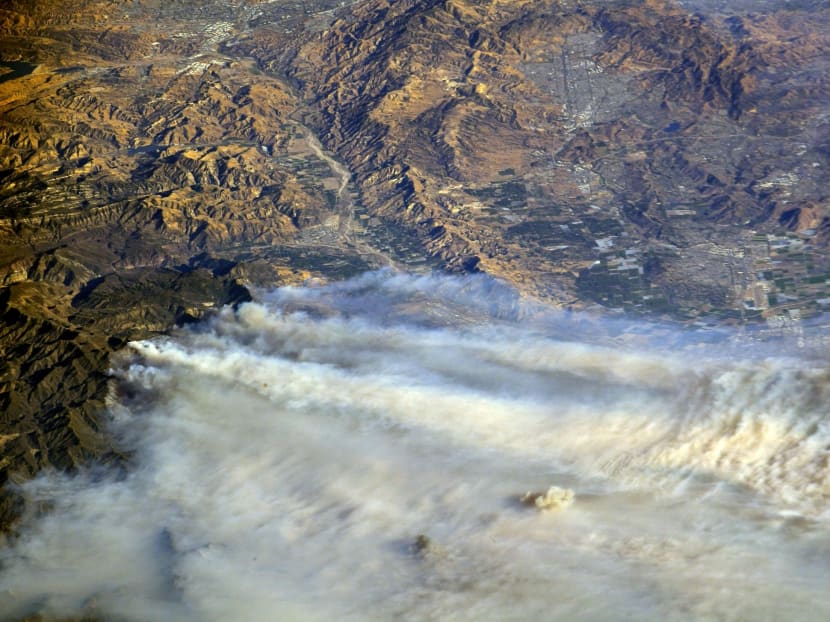 Photo of the day: A photo taken from the International Space Station and moved on social media by astronaut Randy Bresnik shows smoke rising from wildfire burning in Southern California, US. Photo: NASA via Reuters