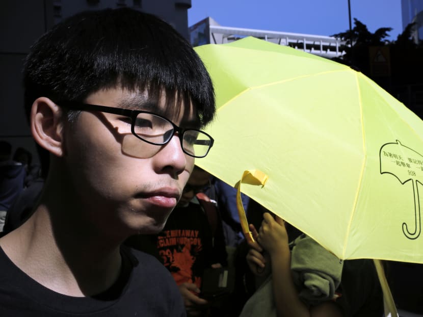 Student leader Joshua Wong at police headquarters in Hong Kong, Friday, Jan. 16, 2015.  AP file photo
