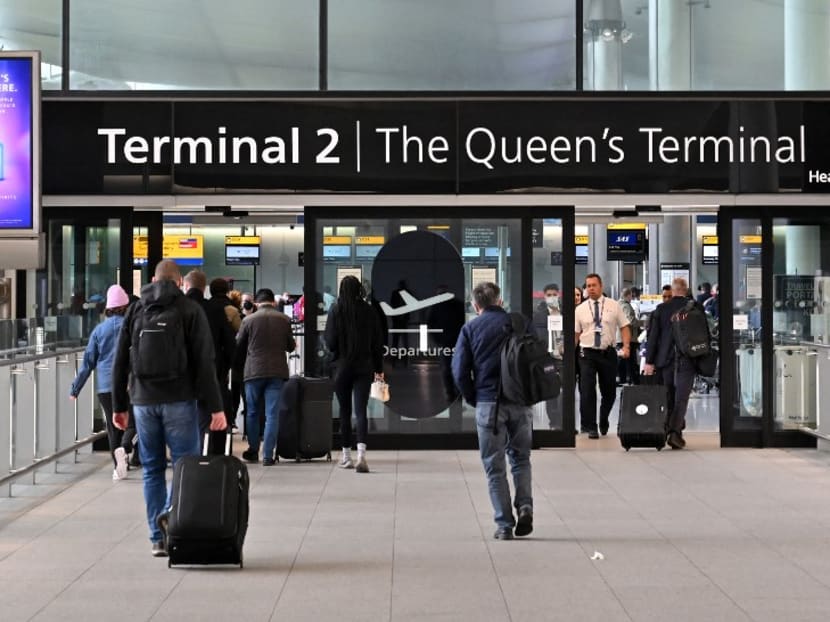 Holidaymakers and travellers arrive at Terminal 2 of London Heathrow Airport in west London, on April 6, 2022. Holidaymakers and travellers arrive at Terminal 2 of London Heathrow Airport in west London, on April 6, 2022.