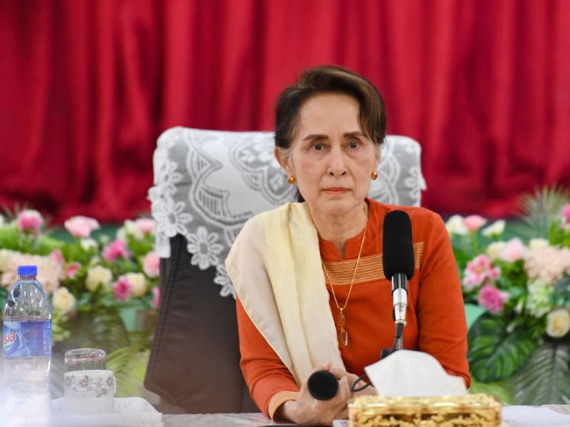 This file photo taken on March 14, 2019 shows Myanmar's then state counselor Aung San Suu Kyi listening to a question from local people during a visit in Thayarwaddy township, Bago Region