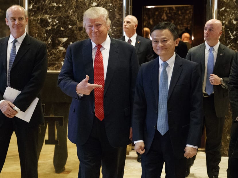 President-elect Donald Trump stands with Alibaba Executive Chairman Jack Ma as they walk to speak with reporters after a meeting at Trump Tower in New York, Monday, Jan. 9, 2017. Photo: AP