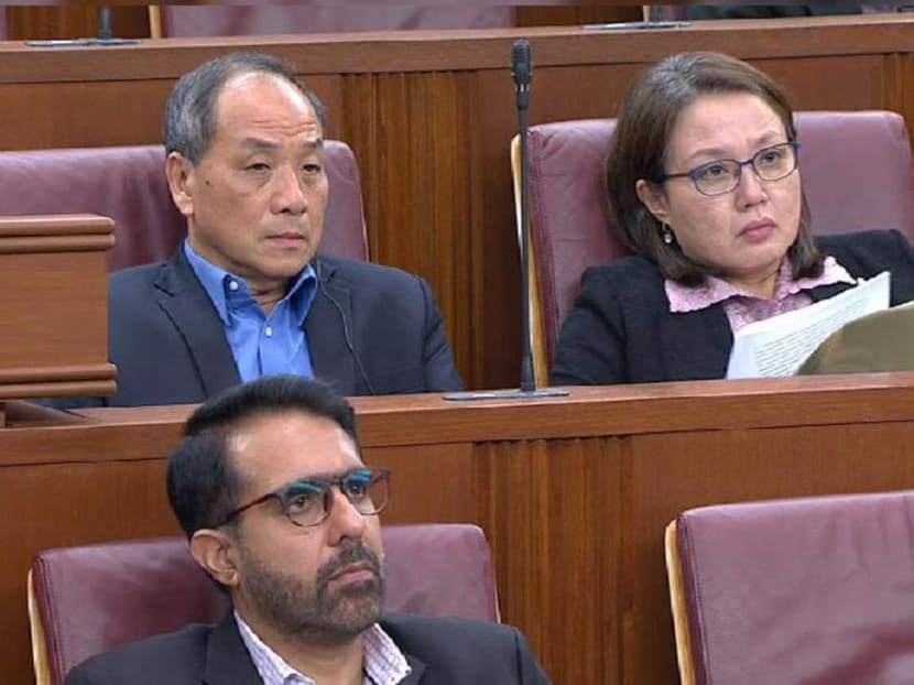 The High Court had found Ms Lim and Mr Low (back row) to have breached their fiduciary duties and failing to act in the town council's best interests.