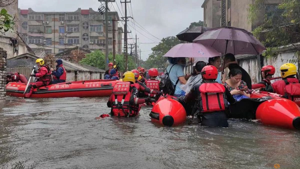 China evacuates 40,000 people from floods, more rain expected