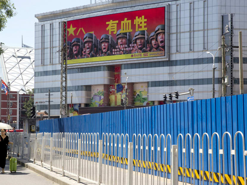 A billboard in Beijing promoting the concept of a ‘courageous’ Chinese military. China is calling for Indian troops to withdraw from Doklam, a disputed Himalayan border area. Photo: AP