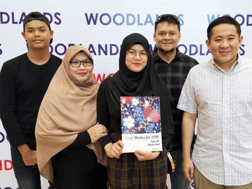 Ms Nuwairah (middle) with her parents and younger brother at the Edusave Awards ceremony at Woodlands Community Centre in 2019. She received the Edusave merit bursary from Mr Amrin Amin (right), former member of parliament for Sembawang GRC. Photo: Republic Polytechnic