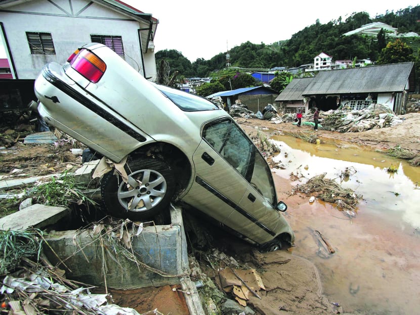 A car damaged by the mudslide at Cameron Highlands yesterday. Photo: AP