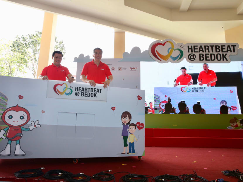 (Right) Prime Minister Lee Hsien Loong and adviser to East Coast GRC’s grassroot organisations Lee Yi Shyan at the official opening of Heartbeat @ Bedok on February 4, 2018Photo: Koh Mui Fong/TODAY