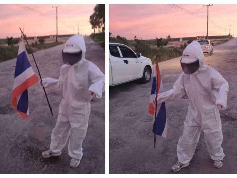 Thai woman ‘discovers new planet’ in astronaut costume in bid to get attention of local authorities to repair neighbourhood potholes