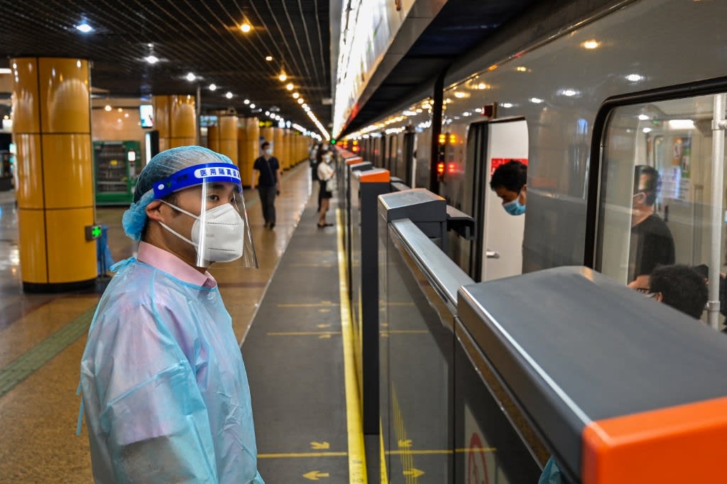 A worker stands in a subway station in the Jing'an district of Shanghai on June 1, 2022, after the end of the lockdown that kept the city two months with heavy-handed restrictions.
