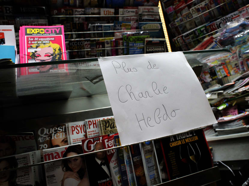A paper reads: "No more Charlie Hebdo" at a newsstand in Paris, Jan 14, 2015. In an emotional act of defiance, Charlie Hebdo resurrected its irreverent and often provocative newspaper, featuring a caricature of the Prophet Muhammad on the cover that drew immediate criticism and threats of more violence. Photo: AP