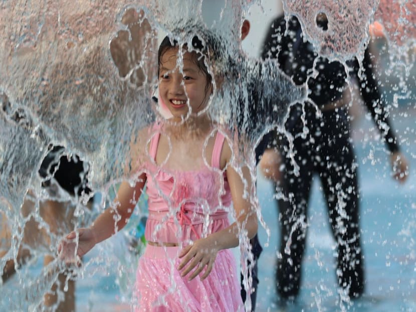 A child cools off at a water park in Xiamen, southeast China’s Fujian province on July 24, 2022. A child cools off at a water park in Xiamen, southeast China’s Fujian province on July 24, 2022.