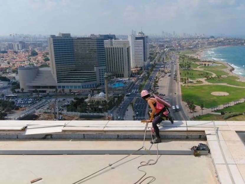 Squeegee selfies: Tel Aviv tower-washer is rising TikTok star Squeegee selfies: Tel Aviv tower-washer is rising TikTok star