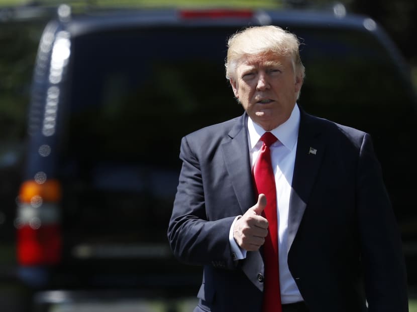 President Donald Trump gives the thumbs-up as he walks to board Marine One on the South Lawn of the White House in Washington. Photo: AP President Donald Trump gives the thumbs-up as he walks to board Marine One on the South Lawn of the White House in Washington. Photo: AP