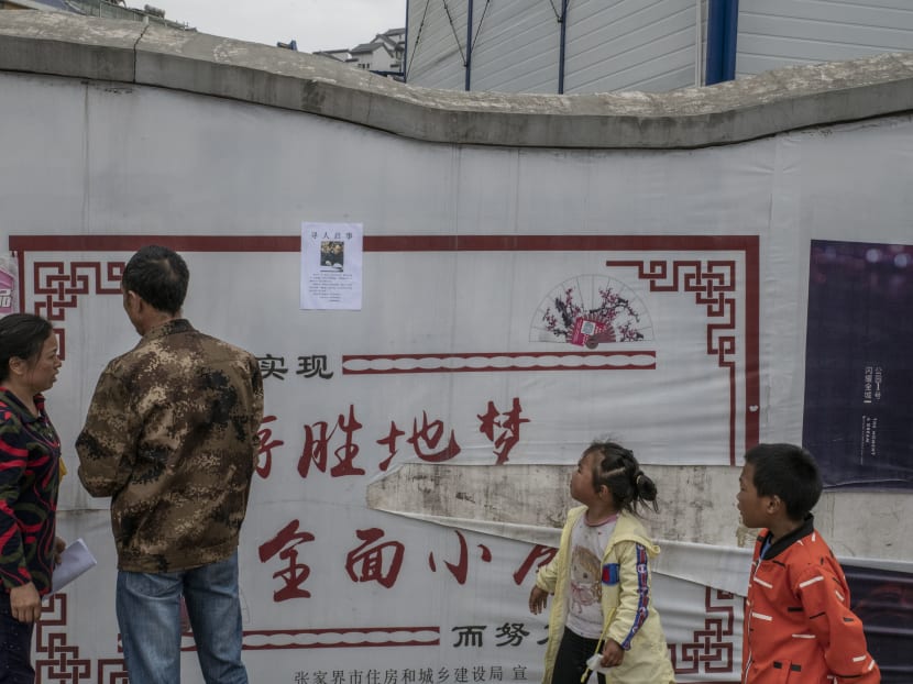 Liao Mandong and her husband, Tang Chunwu, in Zhangjiajie, China, looking for their son, Tang Gongwei, a pharmacist who disappeared after learning he had stomach cancer. Millions in China cannot afford treatments for serious illnesses, and insurance coverage of major illnesses like cancer is low. Liao Mandong and her husband, Tang Chunwu, in Zhangjiajie, China, looking for their son, Tang Gongwei, a pharmacist who disappeared after learning he had stomach cancer. Millions in China cannot afford treatments for serious illnesses, and insurance coverage of major illnesses like cancer is low.