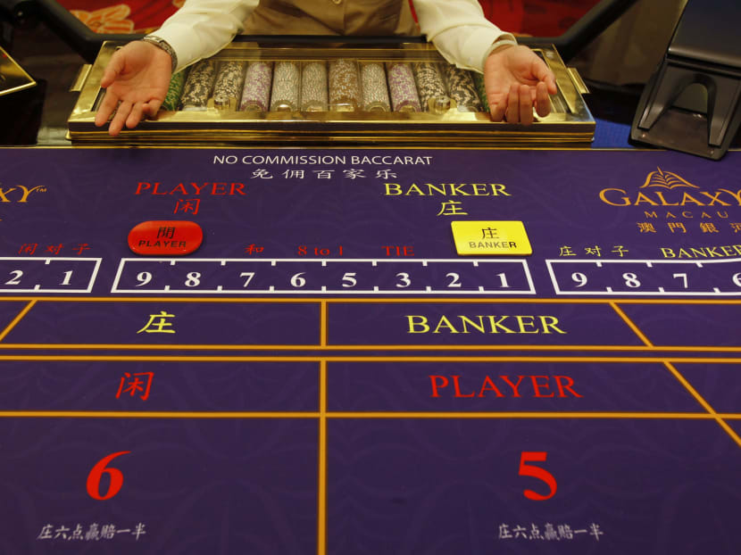 A croupier sits in front of a gaming table inside a casino in Macau in this May 15, 2011 file photo.  Photo: Reuters