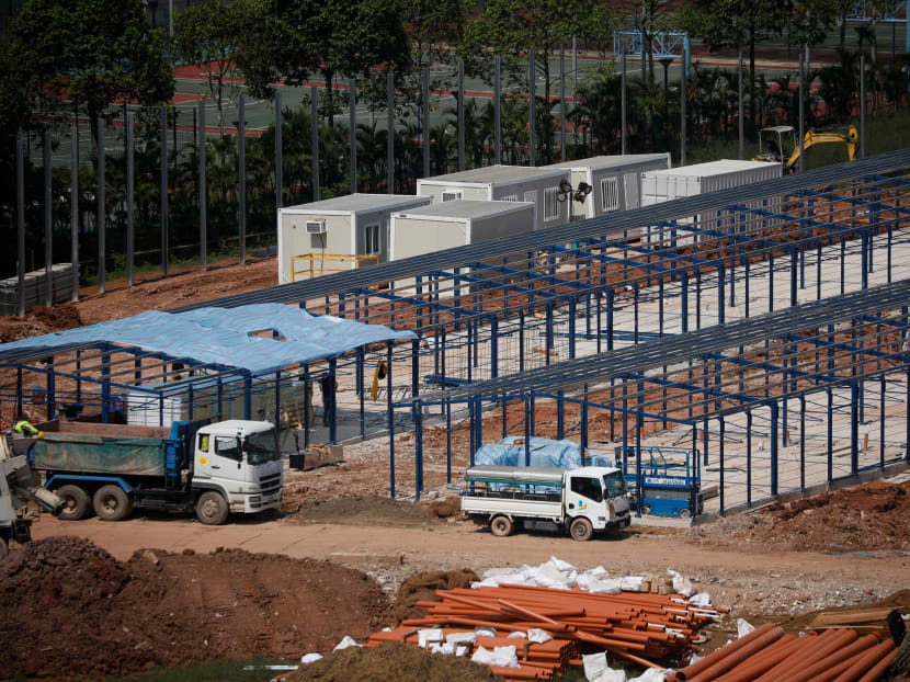 Workers constructing "quick-build" semi-permanent dormitories to house migrant workers in Singapore in this photo taken on June 9, 2020.