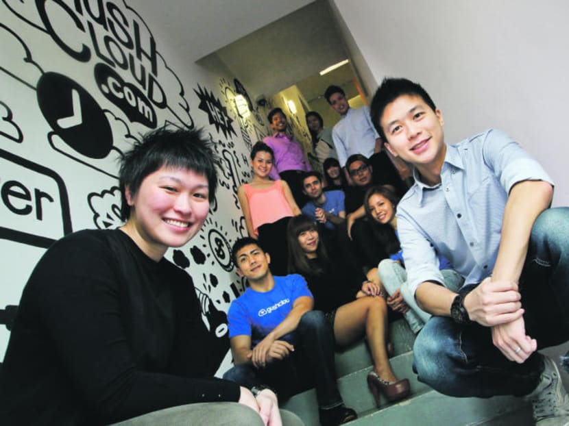 Gushcloud co-founders Althea Lim and Vincent Ha (front) with their team in a file photo taken in May 2013. Photo: Don Wong