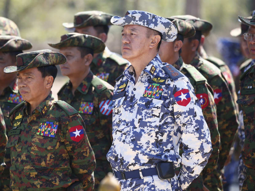 General Maung Maung Kyaw (centre) stands in formation with senior military officials as they listen to the address of Myanmar military commander-in-chief Senior during the second day of 'Sin Phyu Shin' joint military exercises in Ayeyarwaddy delta region, on Feb 3, 2018.