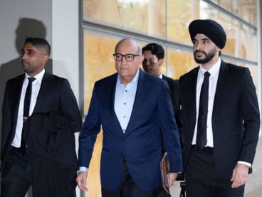 Former transport minister S Iswaran (centre) arrives at the Supreme Court on May 8, 2024 along with his lead lawyer Davinder Singh SC (right).