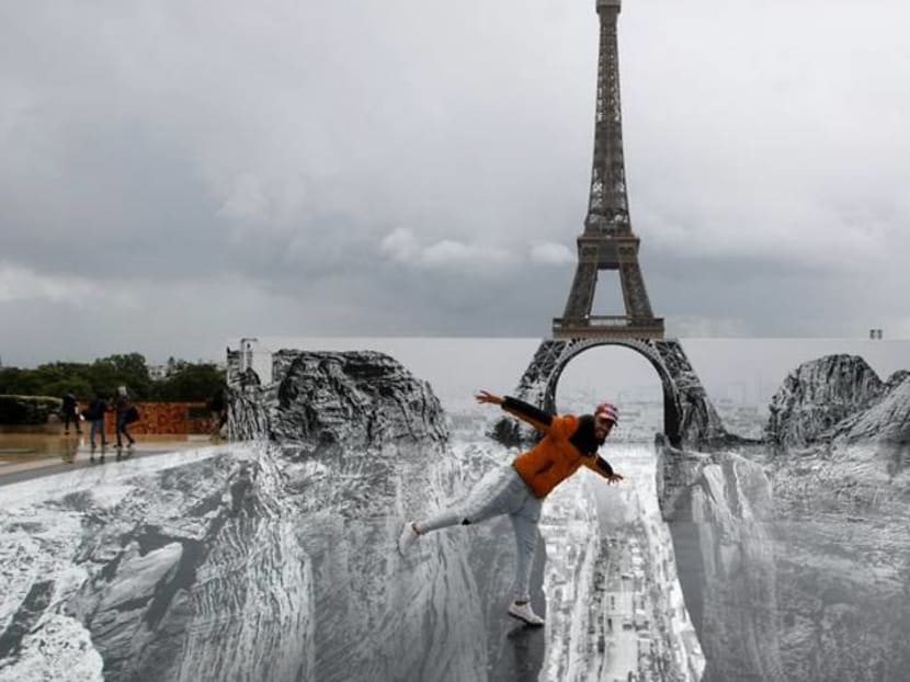 Optical illusion leaves Eiffel Tower teetering over ravine Optical illusion leaves Eiffel Tower teetering over ravine