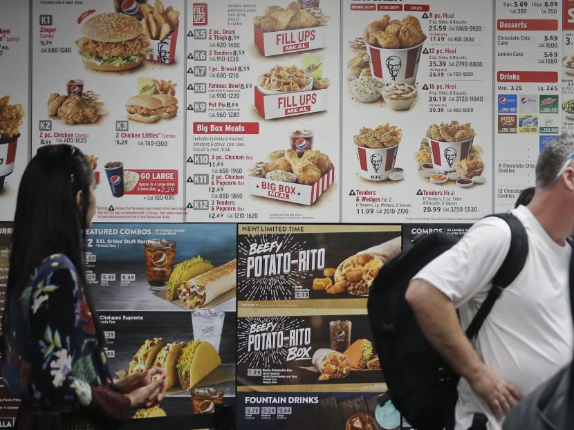 In this Aug. 24, 2017 photo, a KFC menu displays meal selections with calorie counts, in New York. As New York City battles in court over its pioneering rules requiring some restaurants, grocery stores and other eateries to post calorie counts, scientists are trying to judge whether the city's system has achieved a goal of getting people to change bad eating habits. Photo: AP