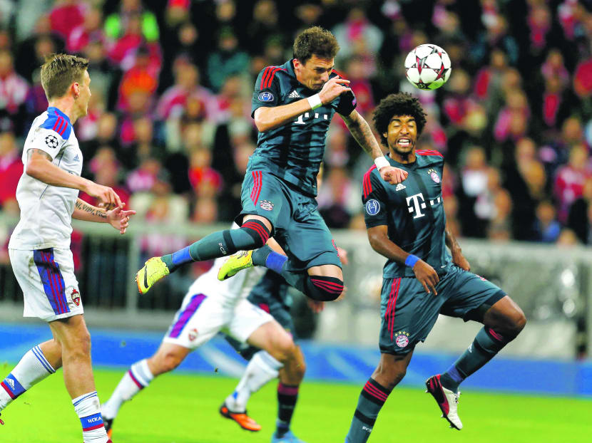 Bayern Munich’s Mario Mandzukic (centre) scoring against CSKA Moscow during their Champions League match in Munich on Tuesday. Photo: Reuters