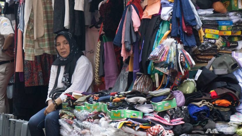 Peddlers versus pedestrians? Jakarta governor's plan to legalise street vendors divides the city Peddlers versus pedestrians? Jakarta governor's plan to legalise street vendors divides the city