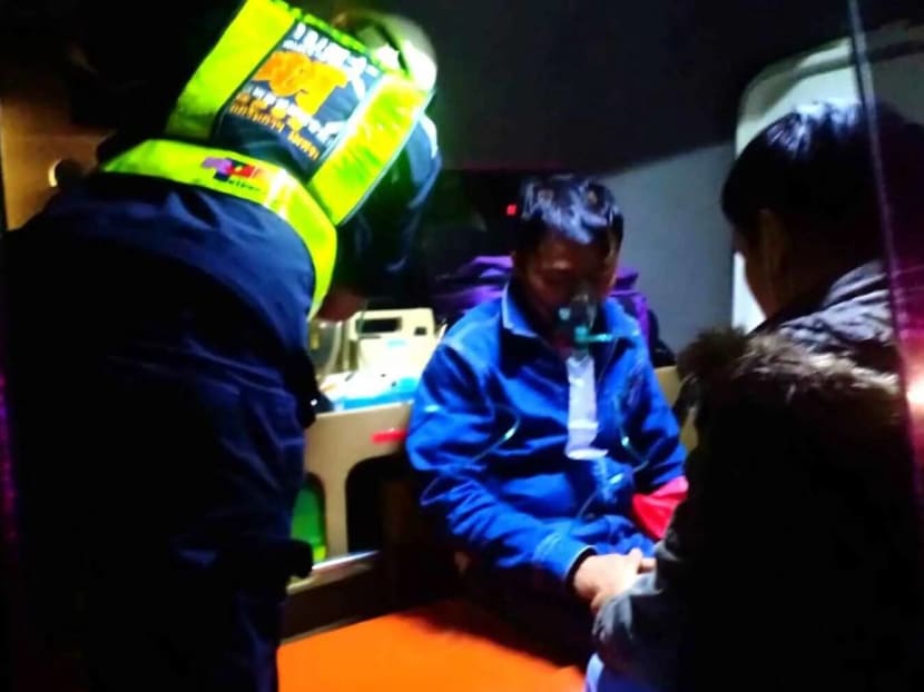 The Singaporean tourist receives first aid after passing out in a gas-leaking room on Phu Thap Boek in Phetchabun province on Wednesday night.