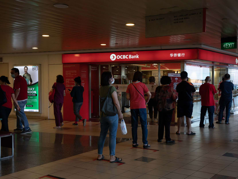 Customers queueing outside OCBC bank at Toa Payoh Central on Feb 4, 2021.