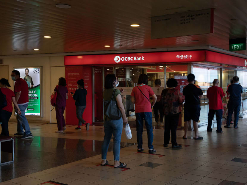 Customers queueing outside OCBC bank at Toa Payoh Central on Feb 4, 2021. Customers queueing outside OCBC bank at Toa Payoh Central on Feb 4, 2021.