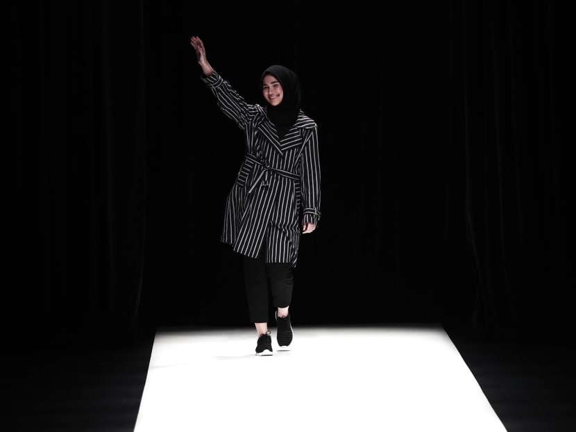 Indonesian designer Rani Hatta greeting guests at the end of her Autumn/Winter 2017 collection during Tokyo Fashion Week in Tokyo on March 22, 2017. Photo: AFP