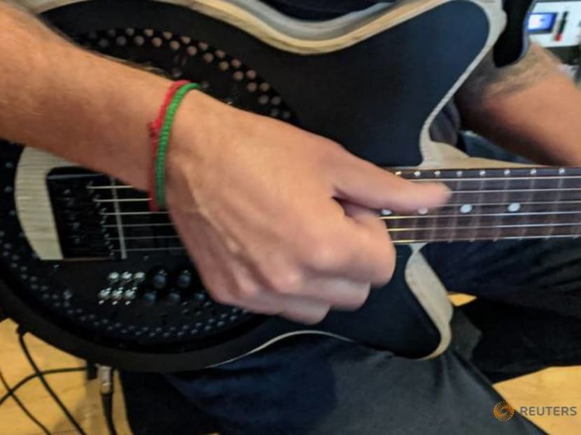 Radical redesign of the electric guitar is put through its paces Radical redesign of the electric guitar is put through its paces