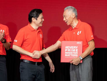 Mr Lawrence Wong (left) and Prime Minister Lee Hsien Loong at the May Day Rally 2024. 