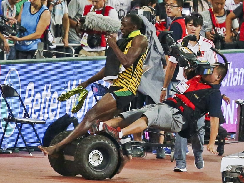 Gallery: Only man who can topple Bolt: A photographer on a scooter