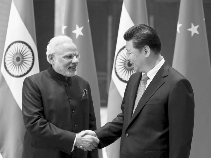 Indian Prime Minister Narendra Modi and Chinese President Xi Jinping in China earlier this year. The AIIB offers a platform for both Asian giants to cooperate in the region. Photo: Reuters