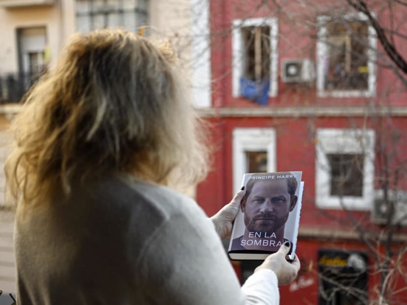 A woman holds the "En la sombra" (In the shadow) Spanish version of the book "Spare" an autobiography by Britain's Prince Harry after buying it in Madrid on Jan 5, 2023, despite the publication date set at Jan 10 with stringent measures in place.
A woman holds the "En la sombra" (In the shadow) Spanish version of the book "Spare" an autobiography by Britain's Prince Harry after buying it in Madrid on Jan 5, 2023, despite the publication date set at Jan 10 with stringent measures in place.