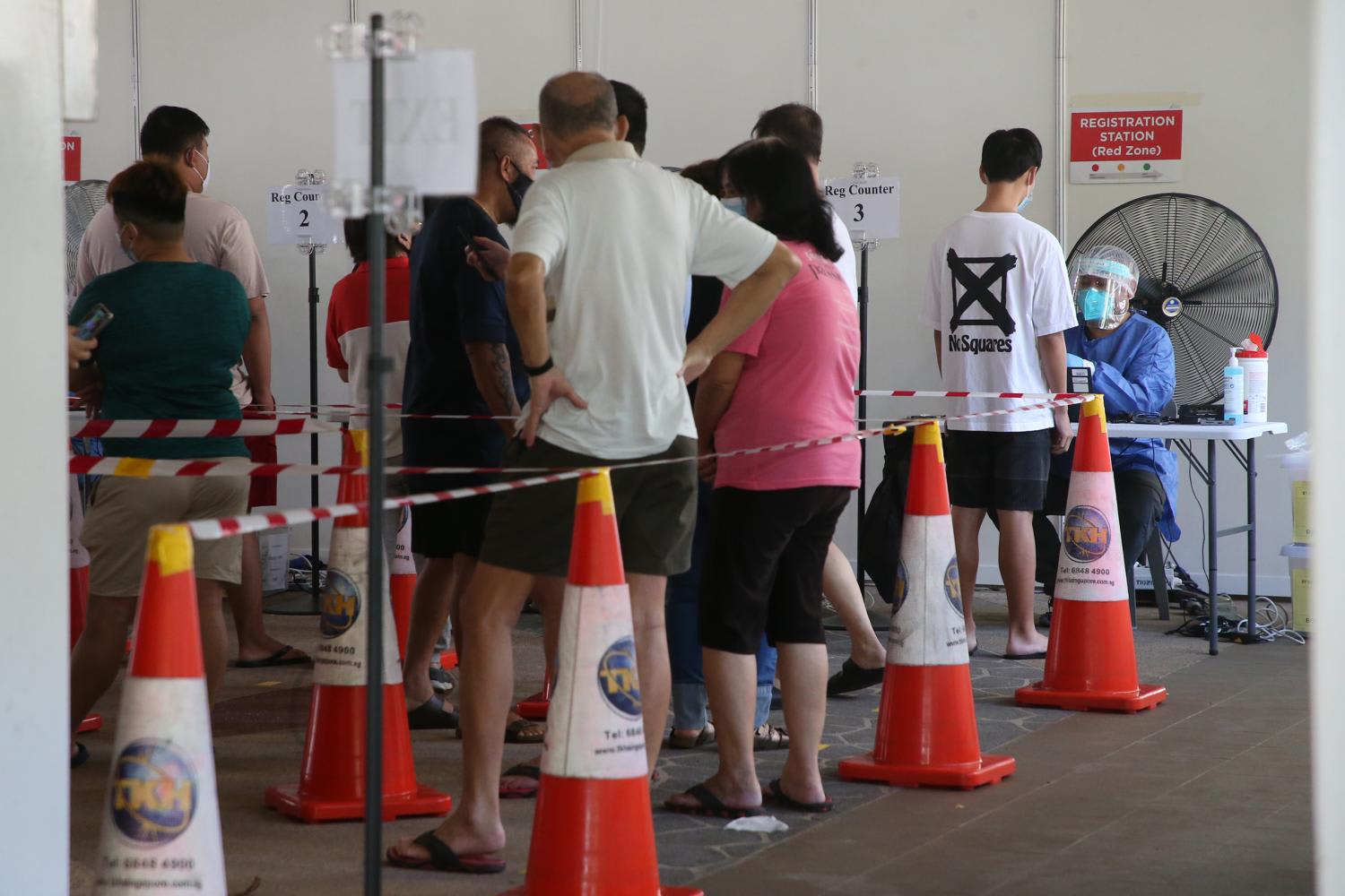 A Covid-19 testing exercise being conducted for all residents living at Blk 456 Ang Mo Kio Ave 10, as well as owners and staff members working at the commercial units there, on July 25, 2021. A Covid-19 testing exercise being conducted for all residents living at Blk 456 Ang Mo Kio Ave 10, as well as owners and staff members working at the commercial units there, on July 25, 2021.