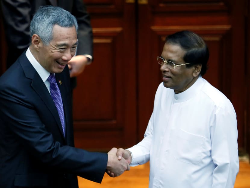 PM Lee shaking hands with Sri Lankan President Maithripala Sirisena in Colombo, Sri Lanka on Tues (Jan 23). During their meeting, both leaders noted the warm friendship between the two countries, including the close historical and cultural ties. Photo: Reuters