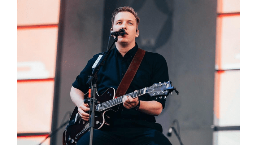 George Ezra plays Isle of Wight festival from chair after leg injury
