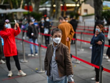 People wait in a line to test for the Covid-19 coronavirus in the Jing'an district in Shanghai on Oct 25, 2022.