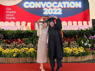 The author (right) with her mother at her graduation ceremony at the Singapore University of Social Sciences in 2022.