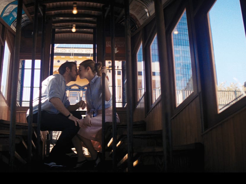 In this undated photo from the Oscar-winning film "La La Land" provided by Lionsgate, actors Ryan Gosling and Emma Stone kiss aboard a railcar on Angels Flight, a tiny railroad in downtown Los Angeles that has been shut down since 2013. Los Angeles officials announced on Wednesday, March 1, 2017, that the antique railroad should be back in service by Labor Day. Photo: Lionsgate via AP