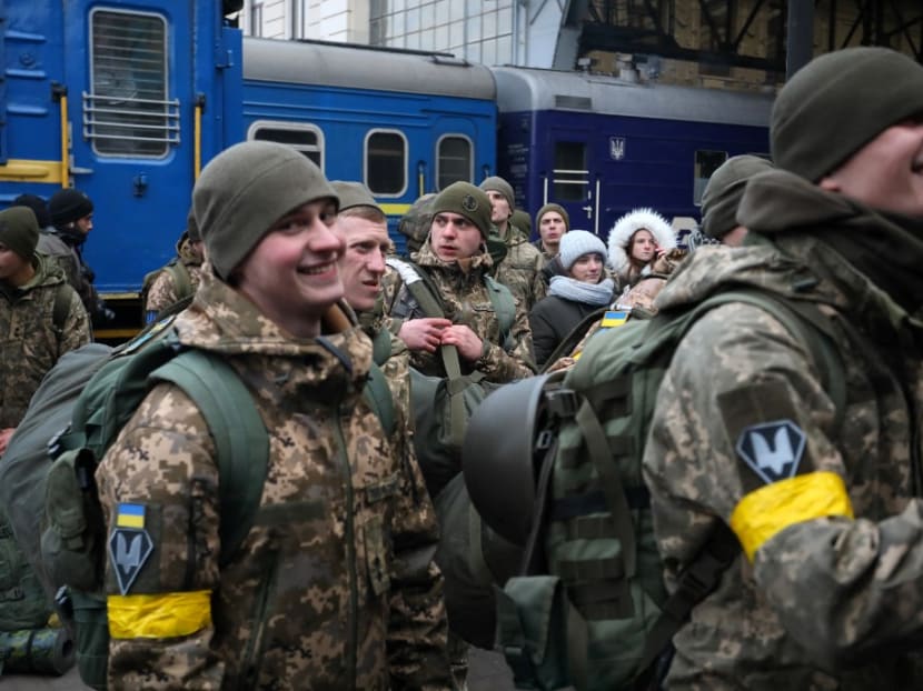 Ukrainian servicemen boarding a train in the western Ukrainian city of Lviv as they depart in the direction of the country's capital Kyiv on March 9, 2022, amid the ongoing Russia's invasion of Ukraine.