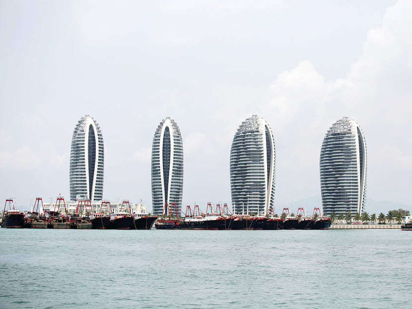 Luxury residential buildings in Hainan. China owes much of its recent growth to debt-financed investment — often in projects such as infrastructure and housing, meant to support the Chinese Dream. PHOTO: BLOOMBERG